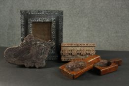 Two carved printing stamps, a pair of Chinese butter moulds and a hardwood frame with metal