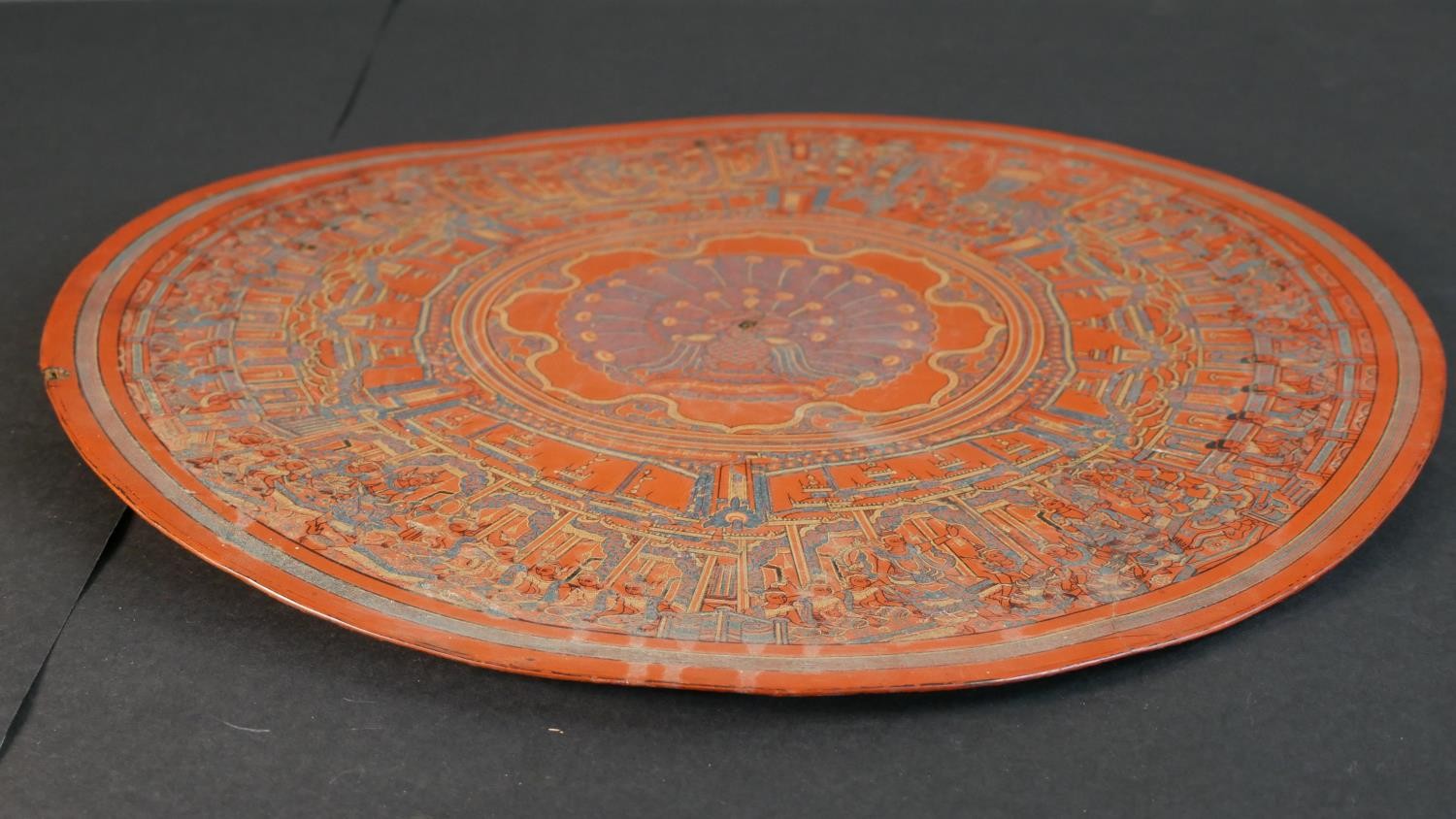 A 19th century engraved lacquer mandala, decorated with figures of Buddha and a peacock to the - Image 6 of 8