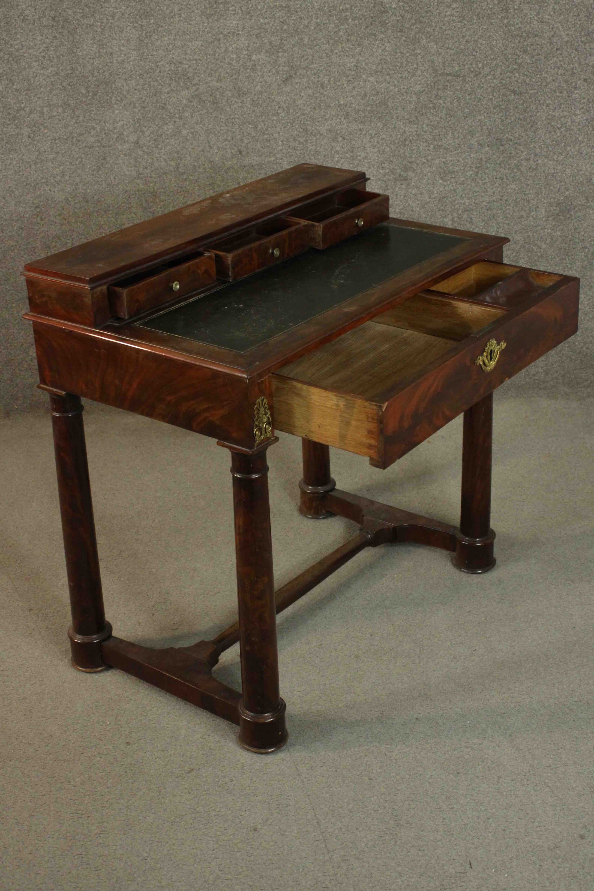 A French Empire flame mahogany writing table, the superstructure with three short drawers, over a - Image 5 of 9