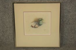 A framed and glazed still life etching, edition 82/99, indistinctly signed. H.35 W.35cm.