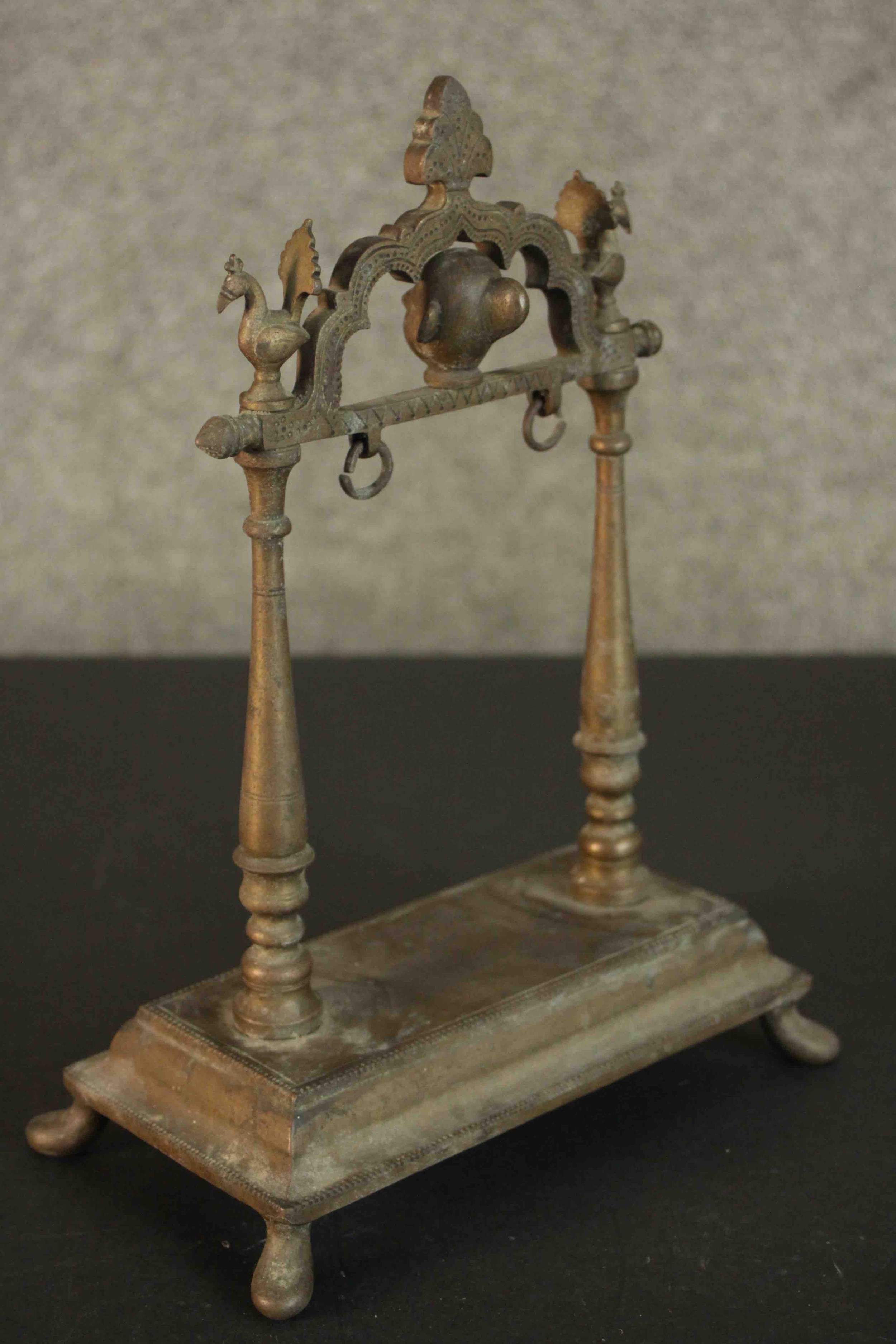 A 19th century Indian bronze frame for a gong. H.28 W.21 D.11cm.