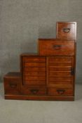 A stepped Japanese Tanshu hardwood chest, with an arrangement of five drawers.