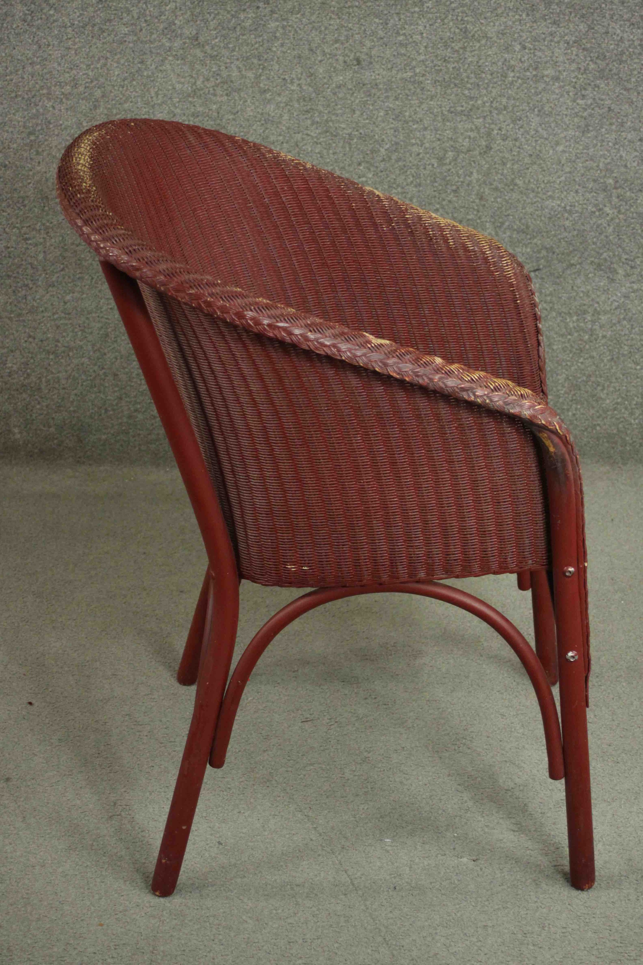 A red Lloyd Loom woven wicker tub chair, bearing brass Lloyd Lloom label. - Image 3 of 7