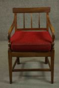 A Regency fruitwood bar back open armchair, the arms with turned vase supports, with a red loose