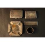 A collection of silver items, including a silver Art Deco engine decorated ashtray with four
