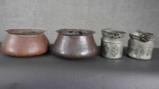 Two early 20th century Indian hammered copper lipped water bowls along with two swing handled