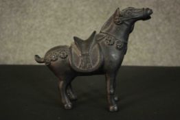 A 20th century Chinese archaistic style bronze horse. H.20.5 W.23 D.9cm.