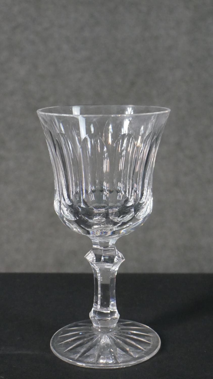 A collection of seven hand cut Waterford crystal wine and sherry glasses with star cut bases. - Image 5 of 6