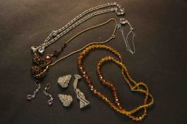 A collection of Art Deco paste jewellery, including a crystal two strand articulated flapper style