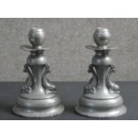 A pair of early 20th century Danish Gerotin dolphin design hammered pewter candle sticks. Maker's
