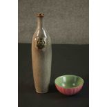 A 20th century dappled glaze Oriental bottle with impressed seal along with a celadon and pink glaze