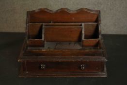 A Victorian and later desk tidy, with correspondence racks and space for inkwells over a single