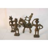 Four early 20th century African tribal bronze figures, one of a man on horseback. H.12 W.12 D.6cm.
