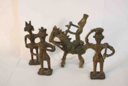Four early 20th century African tribal bronze figures, one of a man on horseback. H.12 W.12 D.6cm.