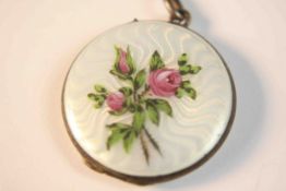 An early 20th century Continental silver enamelled circular locket, white guilloche enamel with a