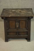 A C.1900 Korean elm table top cabinet with panel doors on block feet. H.61 W.67 D.55cm.