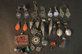 A collection of gem set earrings, pendants and other jewellery. The earrings are set with lapis