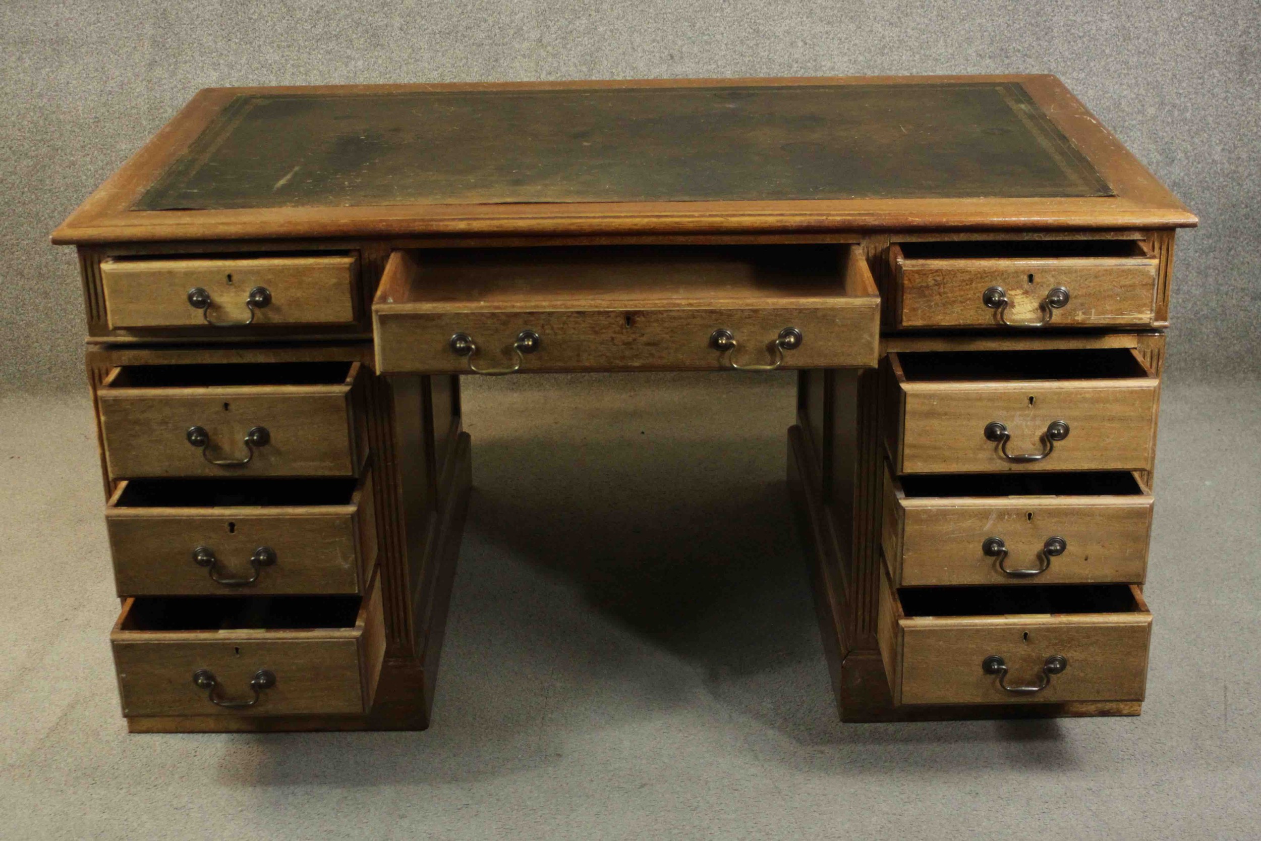 An early 20th century pedestal desk, with a leather writing insert over an arrangement of nine - Image 3 of 11
