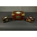 A group of three similar Chinese jewellery boxes, the lid of each set with a carved oval jade or