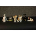 A collection of nine hand painted porcelain and ceramic animals including, different breeds of