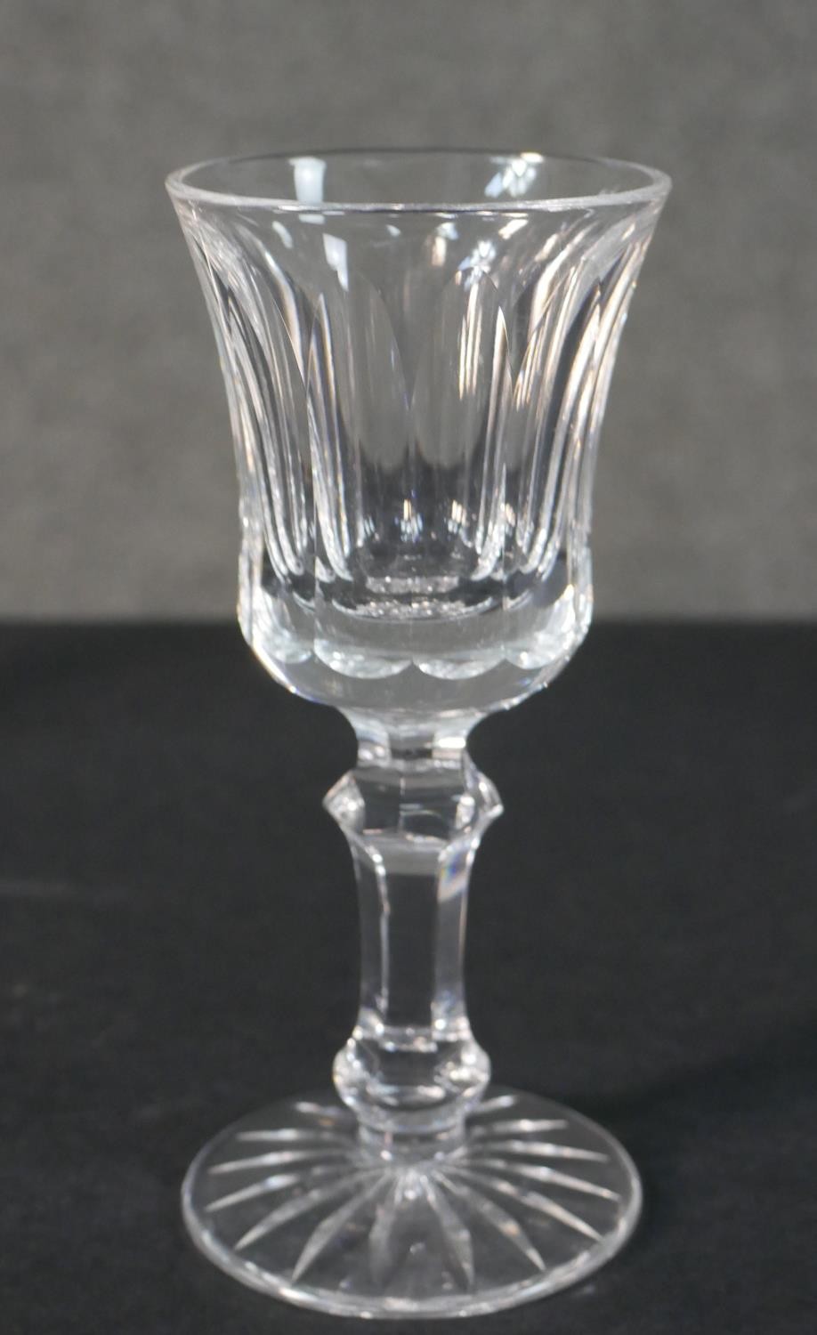 A collection of seven hand cut Waterford crystal wine and sherry glasses with star cut bases. - Image 3 of 6