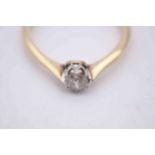 A boxed Edwardian gold and platinum old mine diamond solitaire diamond ring, set to centre with a