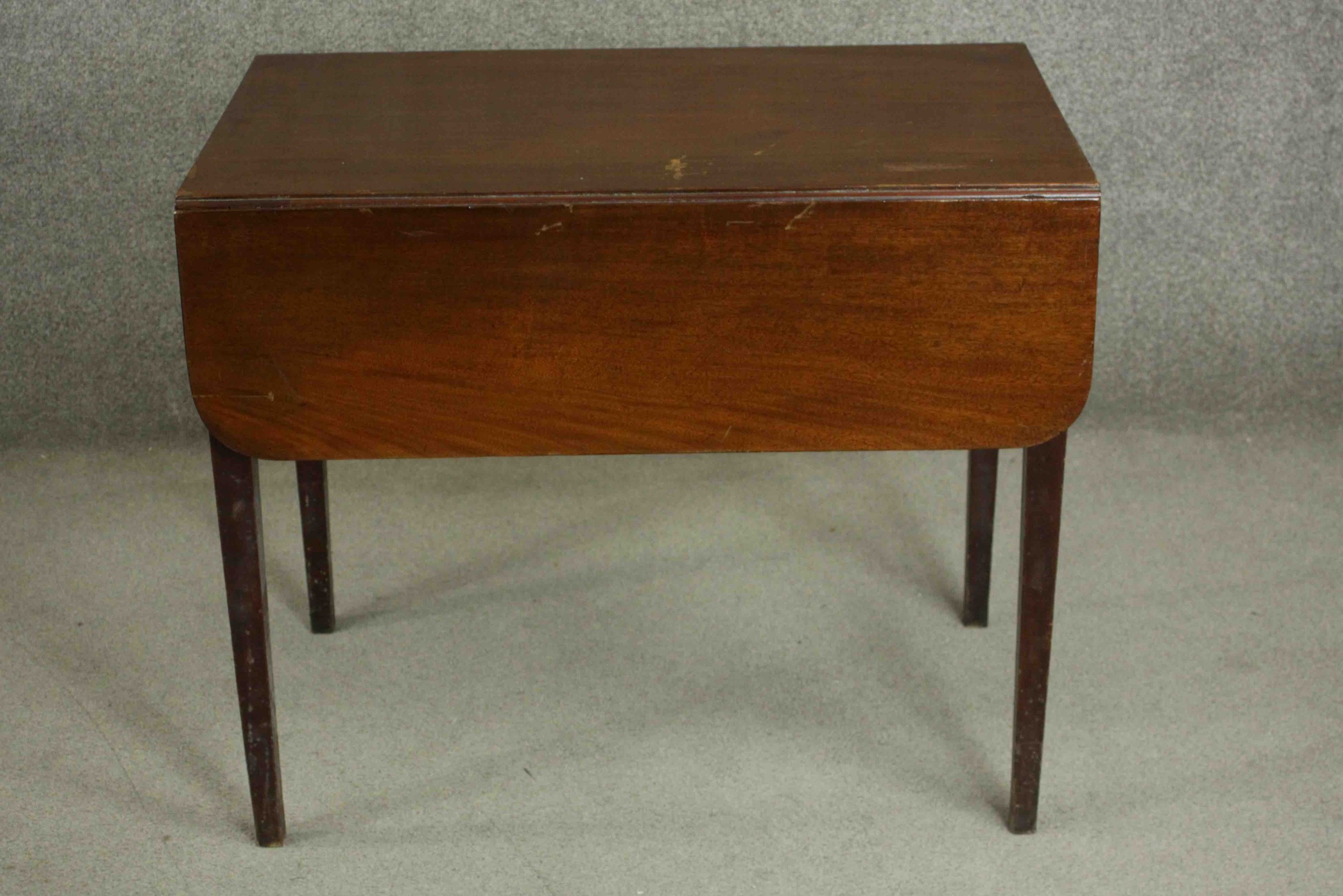 A George III mahogany Pembroke table, with two drop leaves and a single end drawer, on square