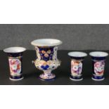 Three 19th century hand painted porcelain vases with floral design panels, royal blue ground and