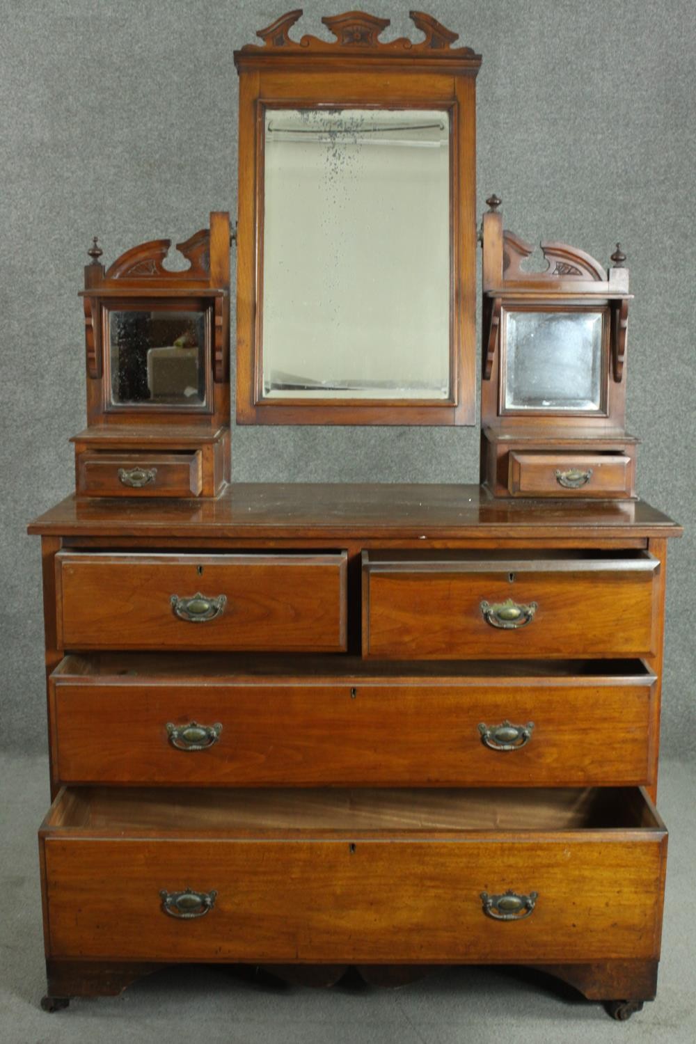 A late Victorian walnut dressing chest, with a central bevelled swing frame mirror, flanked by two - Image 3 of 11