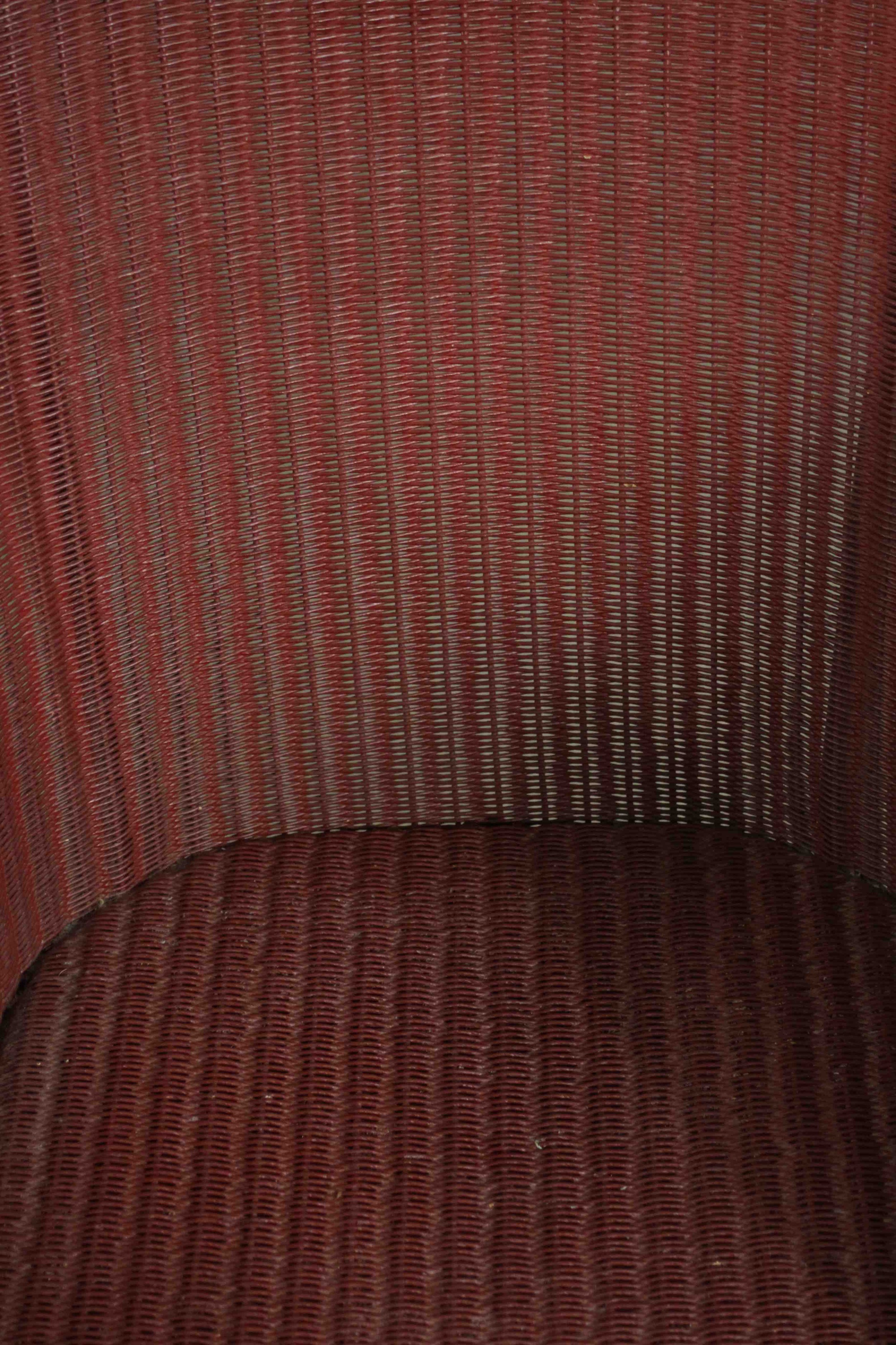 A red Lloyd Loom woven wicker tub chair, bearing brass Lloyd Lloom label. - Image 5 of 7