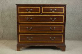 A 20th century Sheraton style mahogany and satinwood inlaid chest, the crossbanded top centred by an