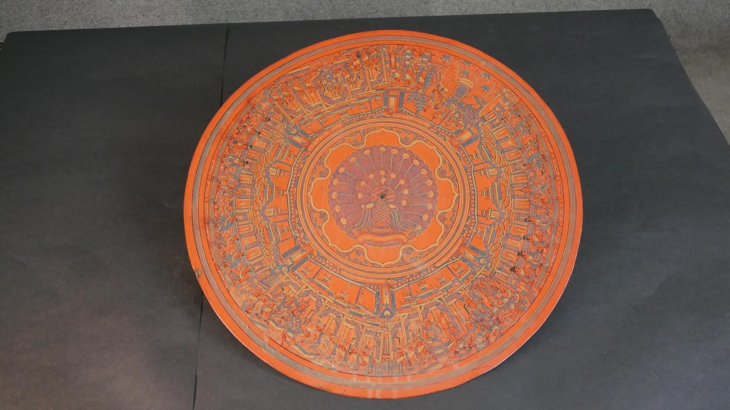 A 19th century engraved lacquer mandala, decorated with figures of Buddha and a peacock to the - Image 2 of 8