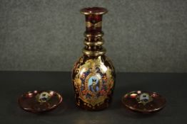 Three cranberry coloured glass items made for the Persian market, decorated with portraits of
