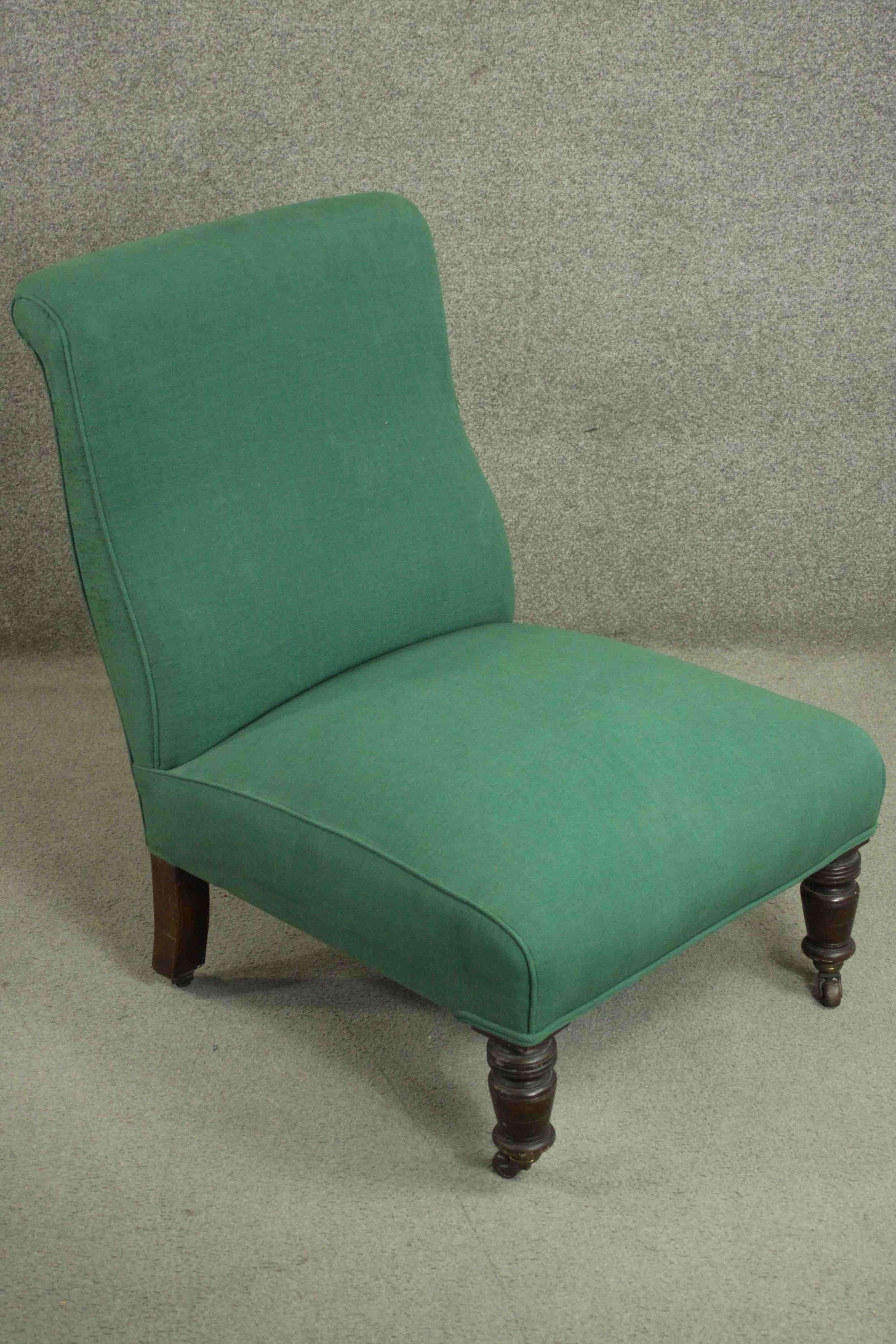 A Victorian mahogany nursing chair, upholstered in green fabric, on ring turned legs. H.85 W.61 D. - Image 2 of 5
