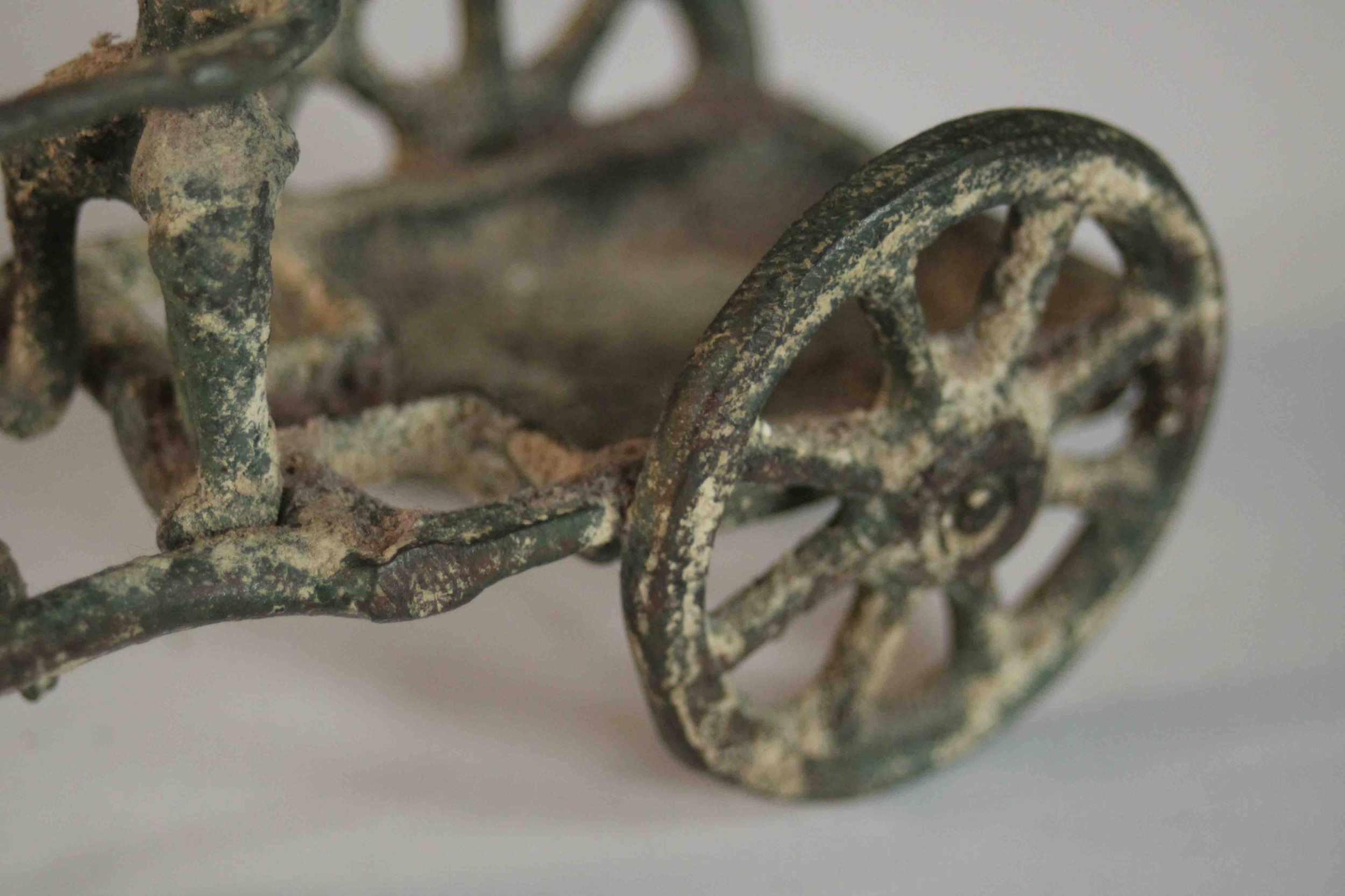 An ancient Greek style bronze of a man riding a horse drawn cart. H.8 W.14 D.6cm. - Image 8 of 8