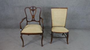 An Edwardian marquetry inlaid open armchair, with a pierced splat back over a pale yellow