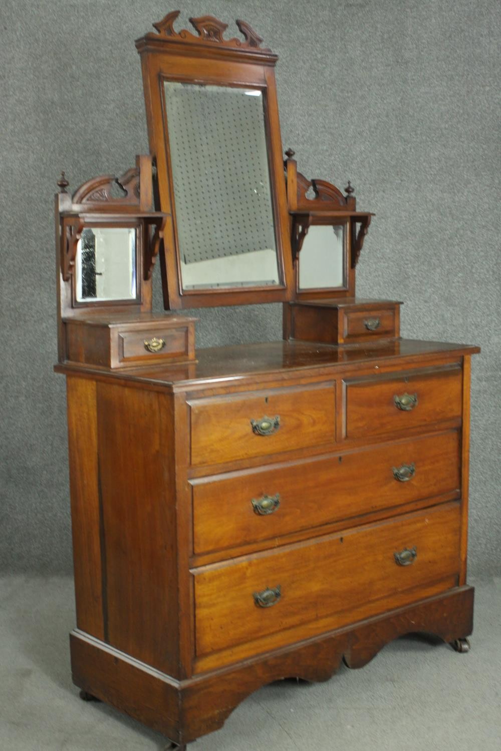 A late Victorian walnut dressing chest, with a central bevelled swing frame mirror, flanked by two - Image 8 of 11