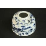 A 19th century blue and white porcelain hand painted brush pot with relief dragon around the rim.