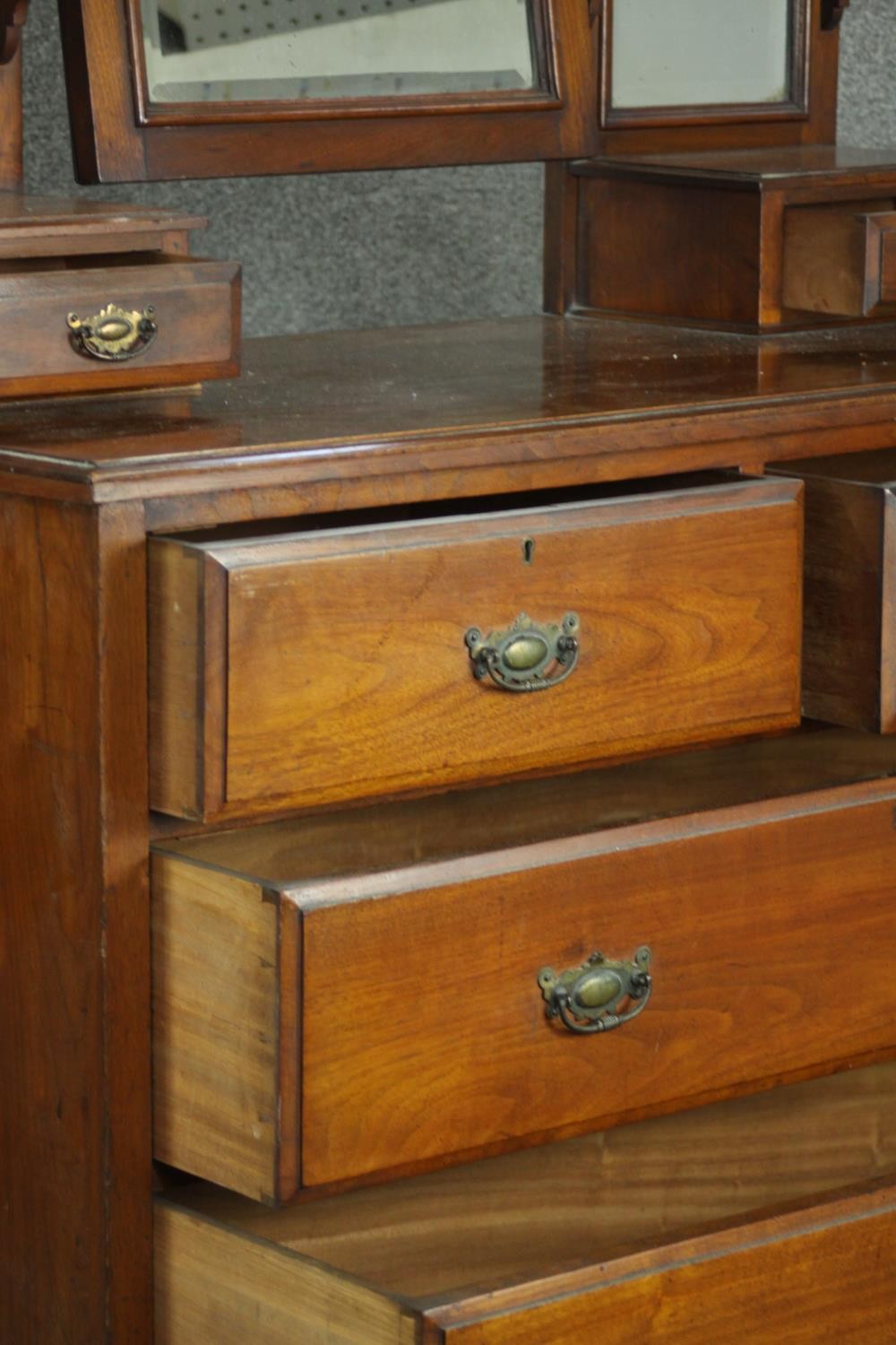 A late Victorian walnut dressing chest, with a central bevelled swing frame mirror, flanked by two - Image 5 of 11