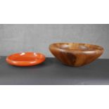 A carved and polished hardwood fruit bowl by Dansk along with a Japanese lacquered bowl.