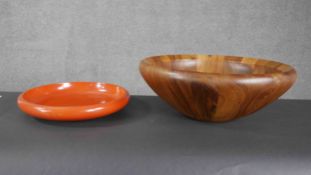 A carved and polished hardwood fruit bowl by Dansk along with a Japanese lacquered bowl.