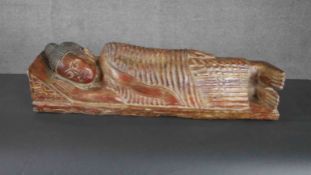 A carved lacquered and gilded lying figure of a Buddha. H.23 W.70 D.20cm.