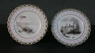 Two 19th century hand painted en grisaille landscape design porcelain plates, each with a pierced