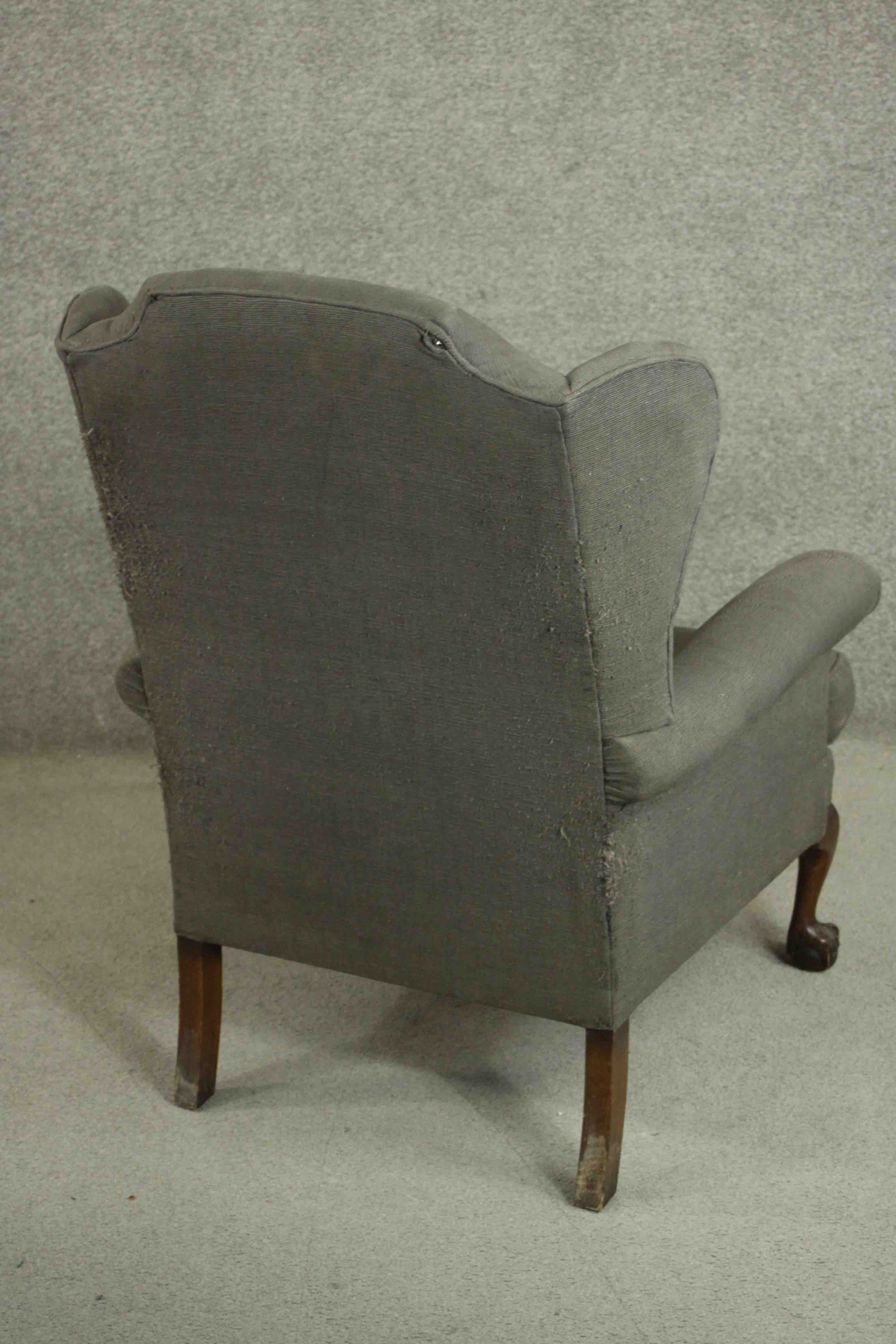 A Victorian wing back armchair, upholstered in grey fabric with scroll arms, on mahogany cabriole - Image 4 of 5