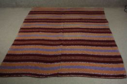 A flatweave Kelim with striped decoration. L.227 W.149cm.