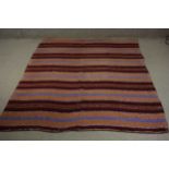 A flatweave Kelim with striped decoration. L.227 W.149cm.