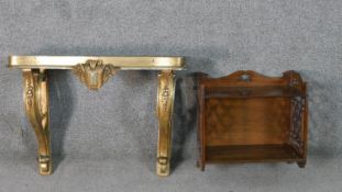 A 19th century Italian parcel gilt and silvered console table, wall mounted but missing the marble