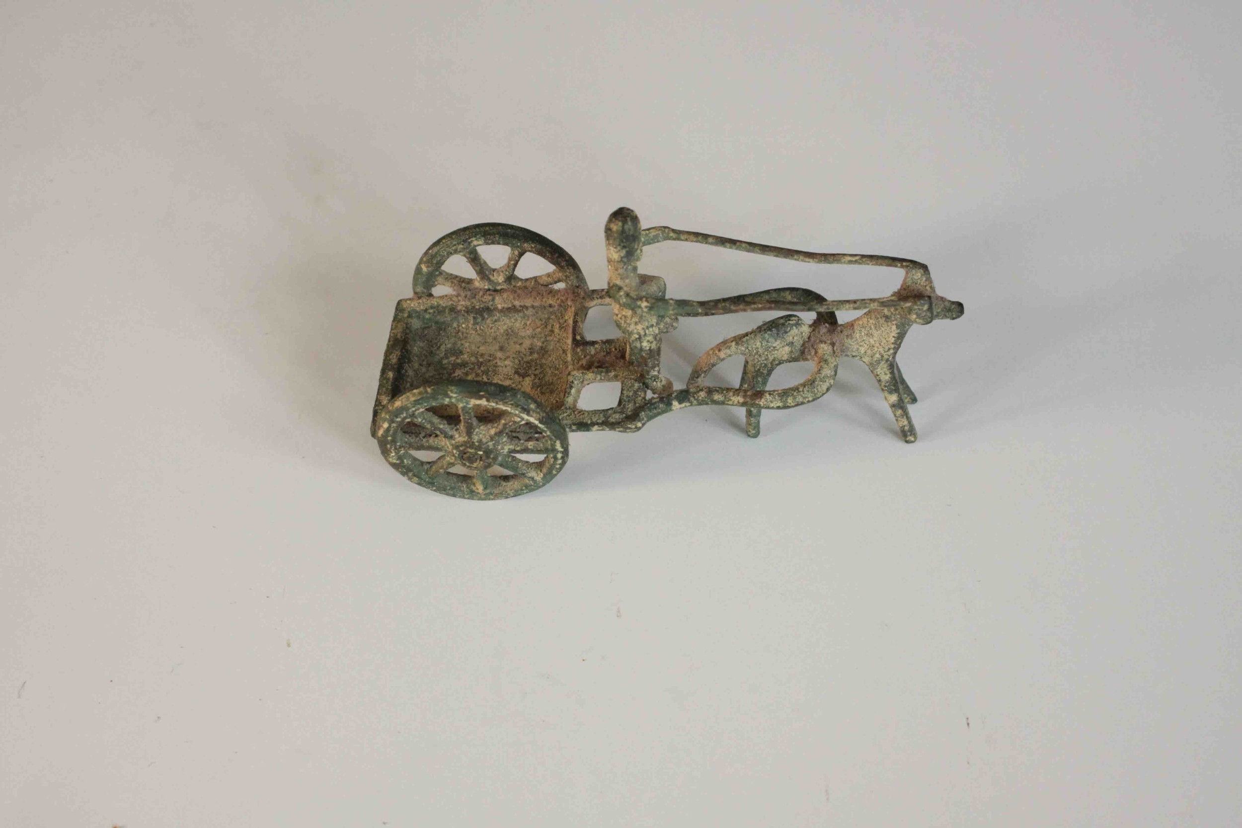 An ancient Greek style bronze of a man riding a horse drawn cart. H.8 W.14 D.6cm. - Image 3 of 8