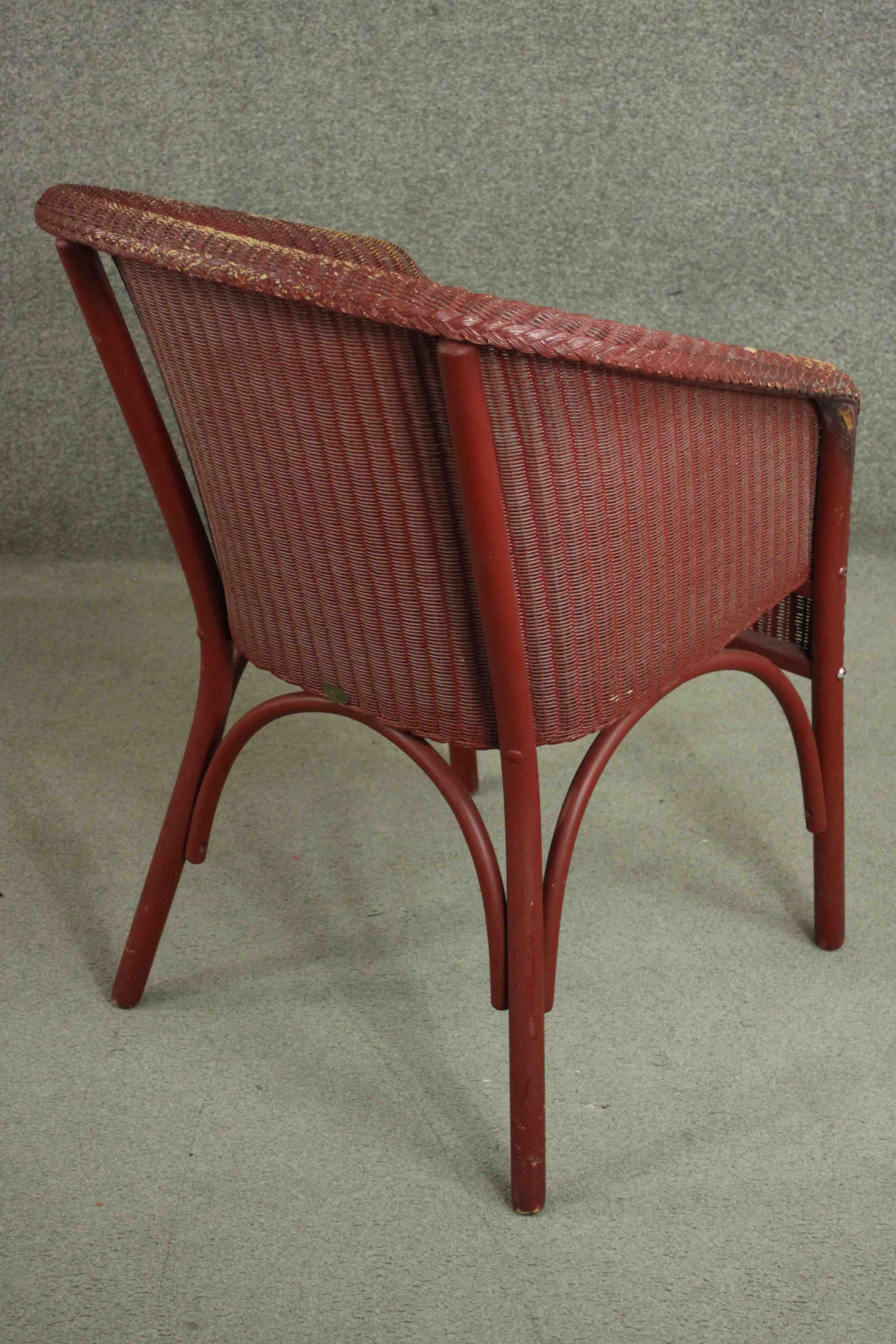 A red Lloyd Loom woven wicker tub chair, bearing brass Lloyd Lloom label. - Image 4 of 7