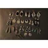 Seventeen pairs of white metal and silver earrings, including pairs set with onyx, amethyst,